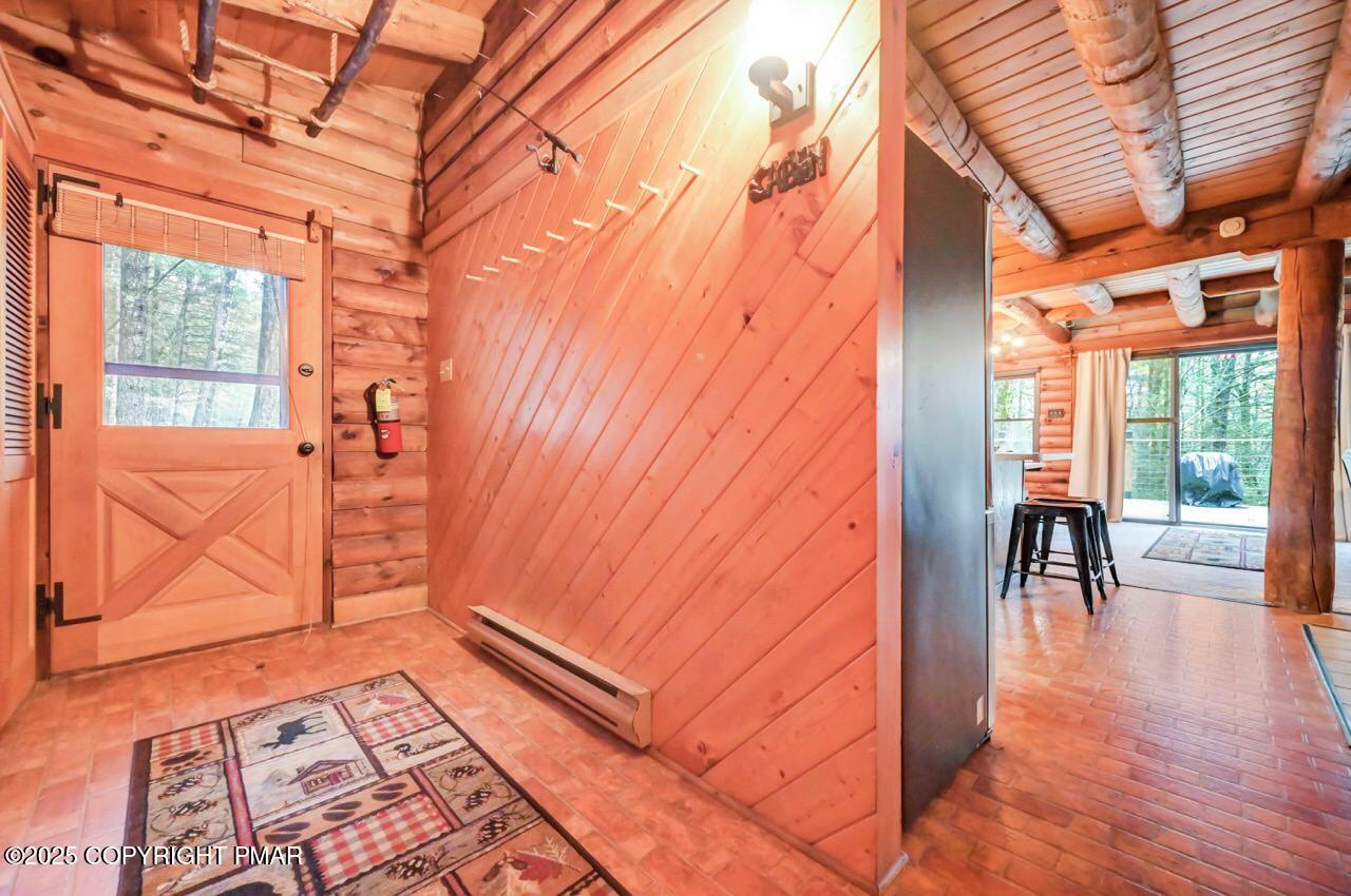 185 Whispering Pine Road Kunkletown, PA 18058 - Photo 6 of 65 a backyard of a house with barbeque oven table and chairs