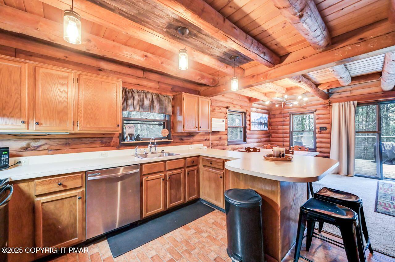 185 Whispering Pine Road Kunkletown, PA 18058 - Photo 8 of 65 a kitchen with stainless steel appliances granite countertop a sink a stove and a refrigerator