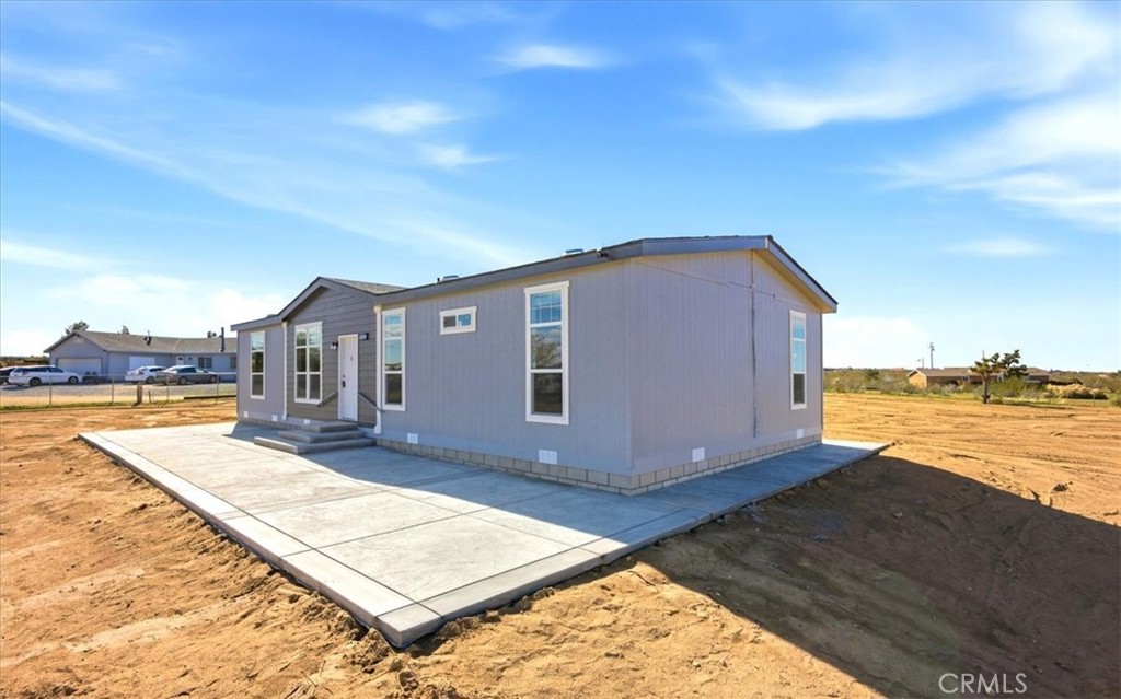 12594 Atsina Road Phelan, CA 92371 - Photo 3 of 37 a view of a house with pool and ocean view