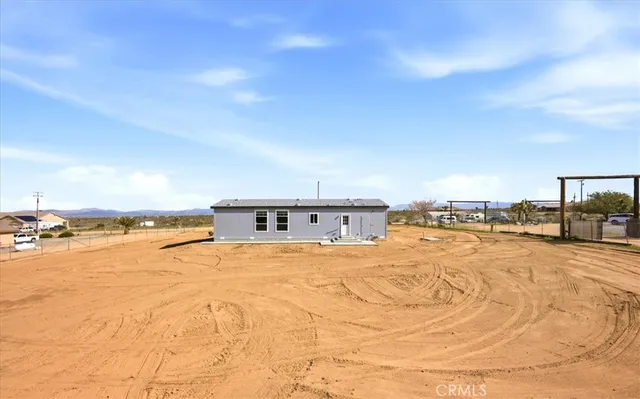 a view of a swimming pool and an outdoor space