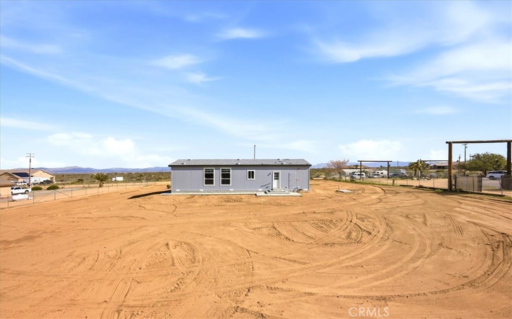 12594 Atsina Road Phelan, CA 92371 - Photo 32 of 37 a view of a swimming pool and an outdoor space