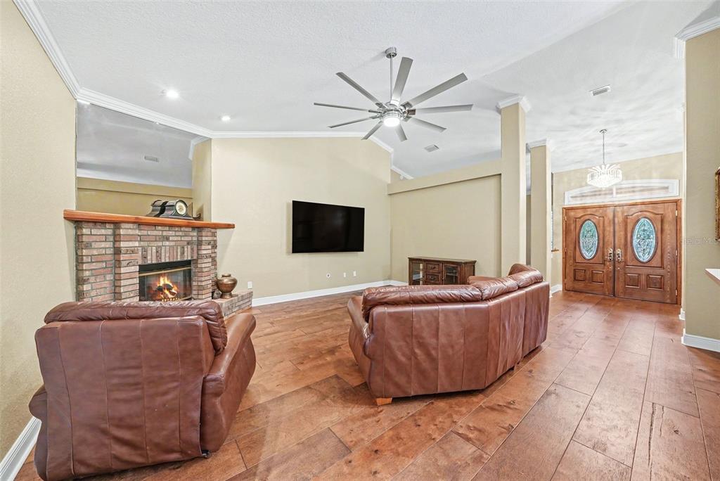 19216 Ridgelake Drive Lutz, FL 33549 - Photo 14 of 31 a living room with furniture and a flat screen tv
