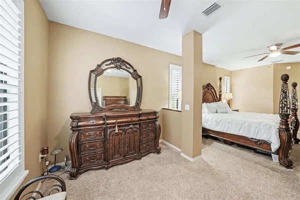 a bedroom with a bed and a dresser