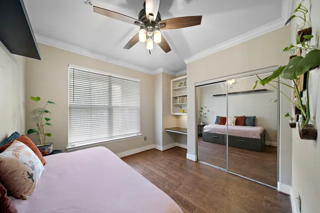 a bedroom with a bed couch and window