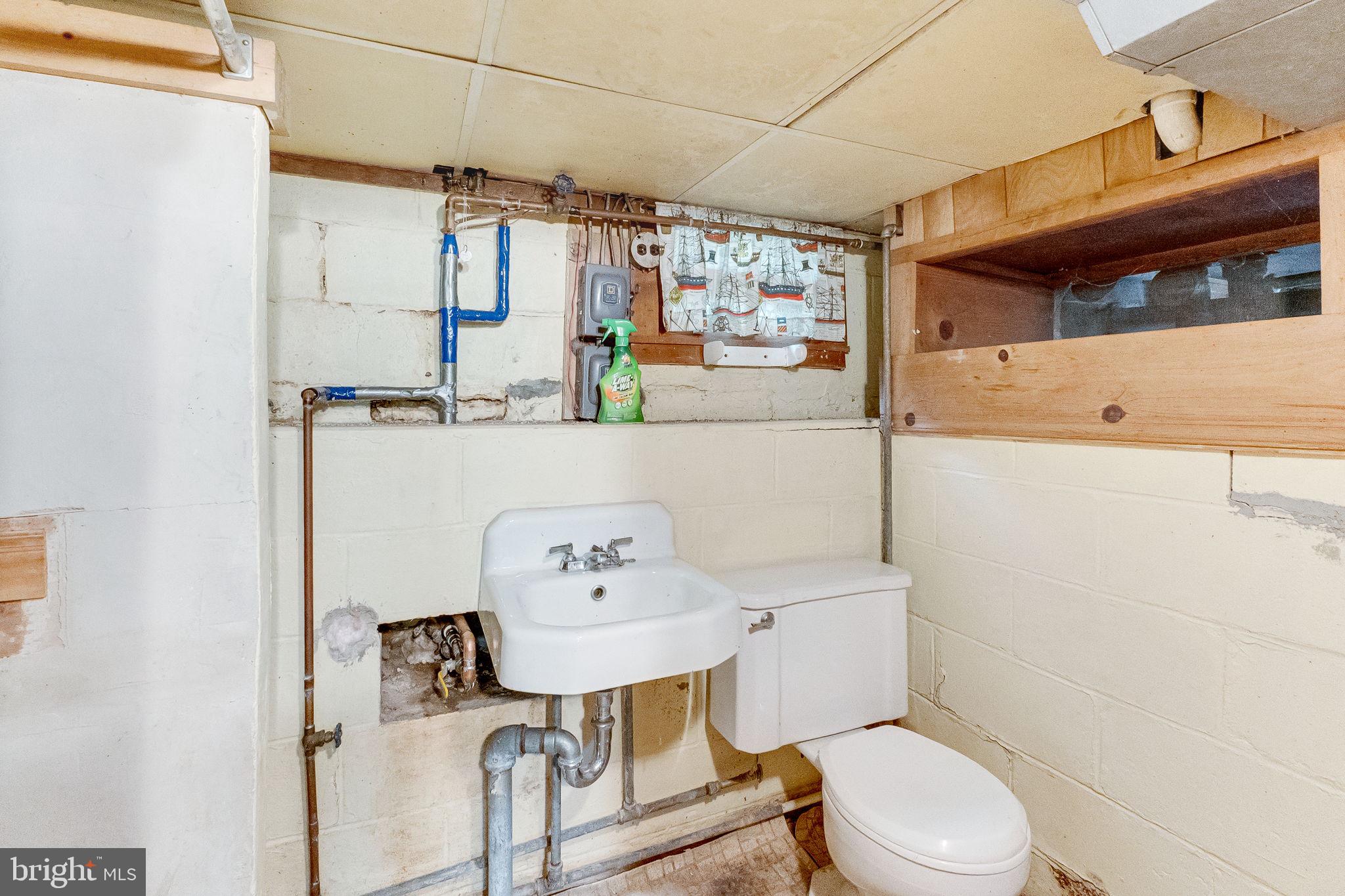 2138 Cedar Road Port Republic, MD 20676 - Photo 23 of 34 a bathroom with a sink toilet and window