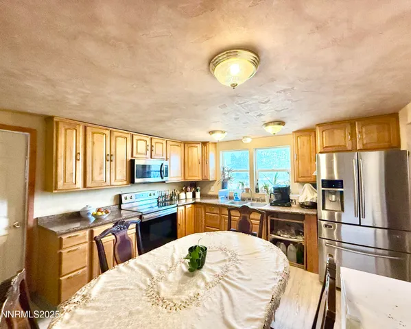 a bedroom with a bed and dresser with mirror