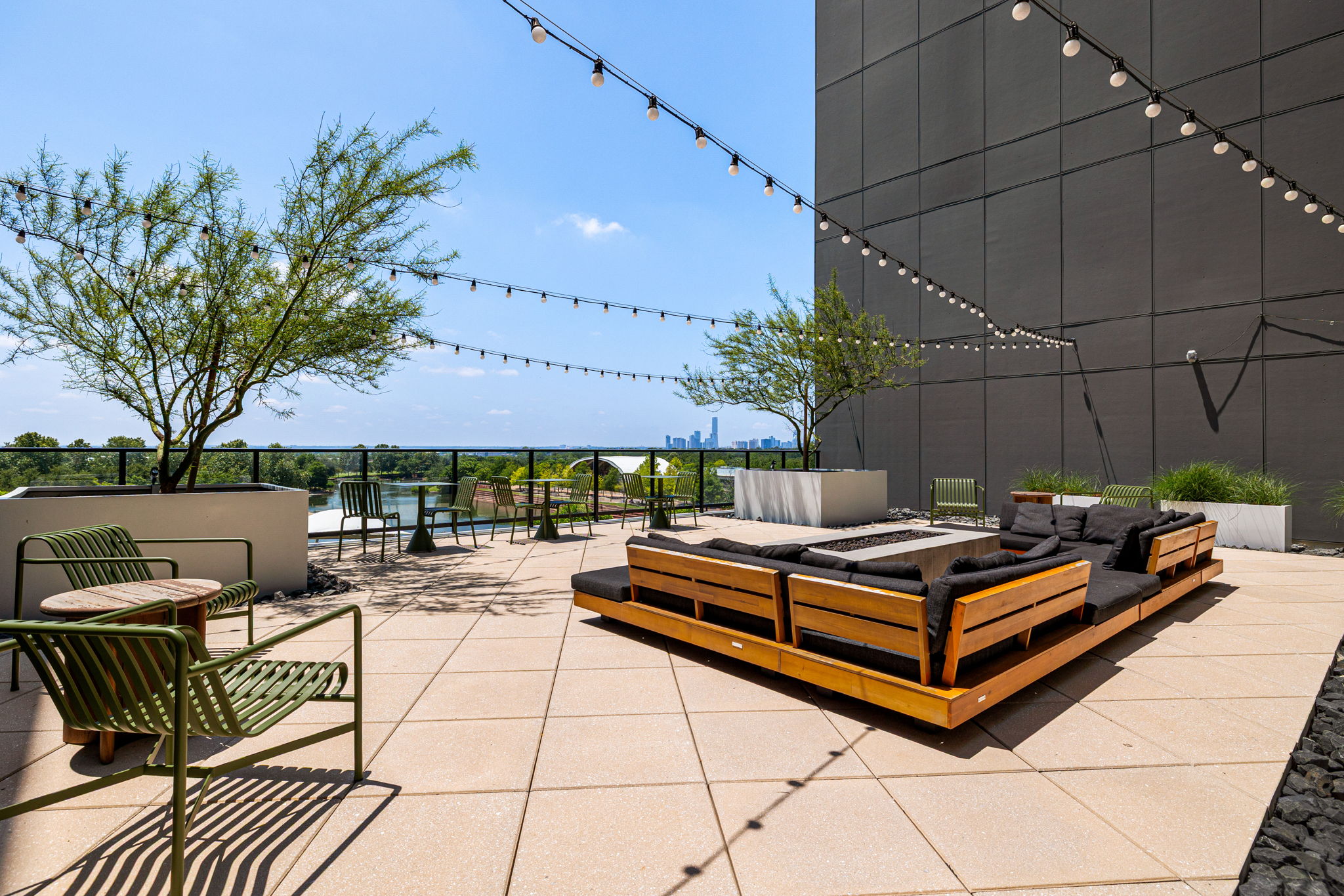 1701 Simond Avenue, Unit 612 Austin, TX 78723 - Photo 27 of 40 a view of a patio with a table and chairs under an umbrella