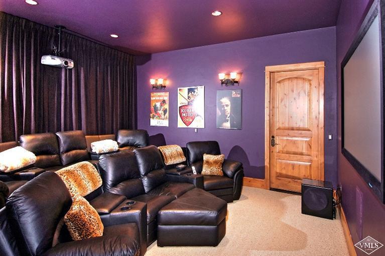 308 Bearden Road Edwards, CO 81632 - Photo 13 of 23 a media room with lots of chairs and a projector screen