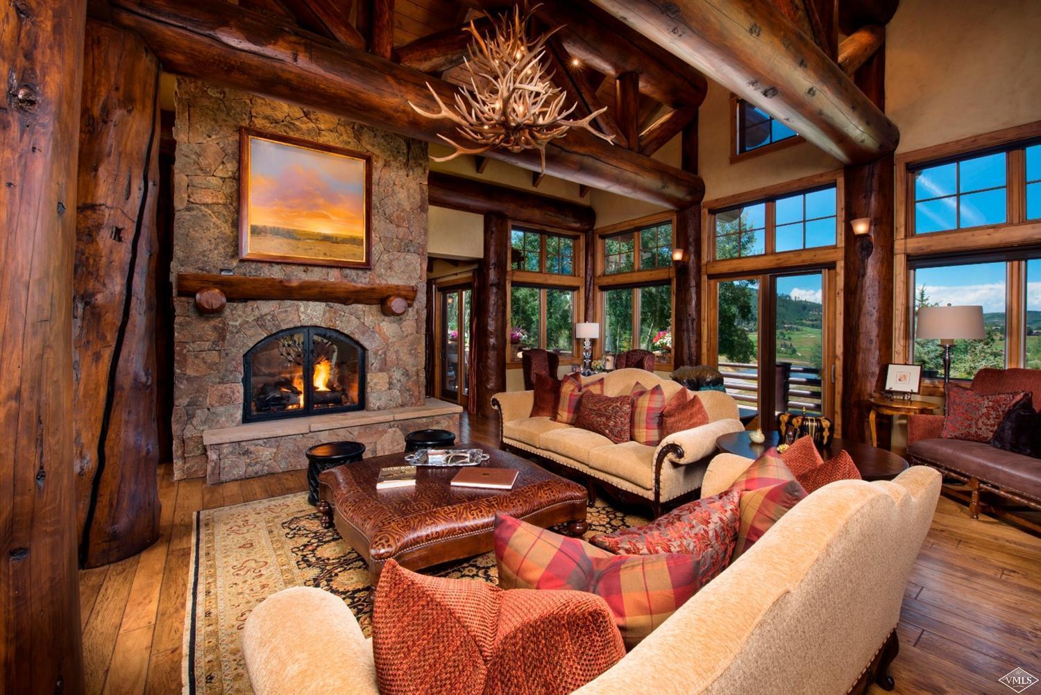 308 Bearden Road Edwards, CO 81632 - Photo 2 of 23 a living room with furniture a fireplace and a flat screen tv