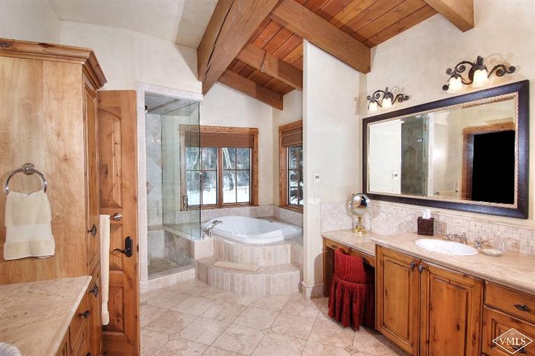 308 Bearden Road Edwards, CO 81632 - Photo 8 of 23 a spacious bathroom with a bathtub sink and mirror