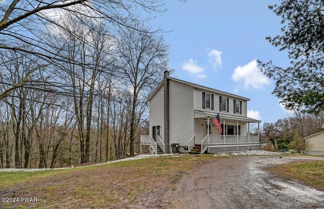 19 Ripple Lane Beach Lake, PA 18405 - Photo 2 of 52 a front view of a house with a yard and garage