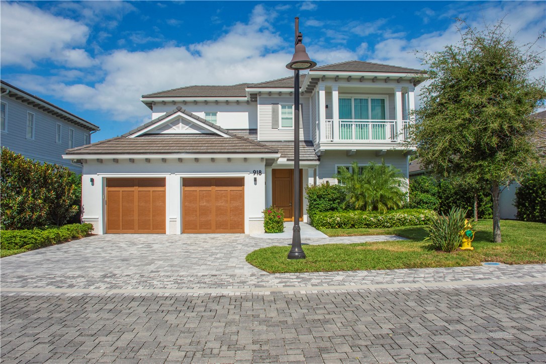 918 Surfsedge Way Indian River Shores, FL 32963 - Photo 2 of 32 a front view of a house with a yard