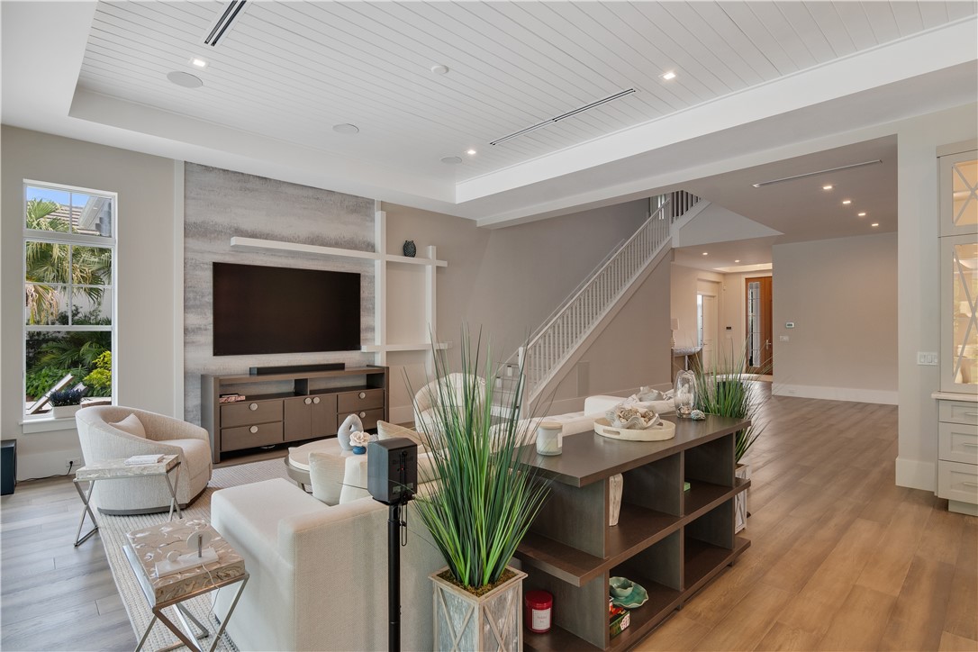 918 Surfsedge Way Indian River Shores, FL 32963 - Photo 21 of 32 a living room with furniture a flat screen tv and a large window