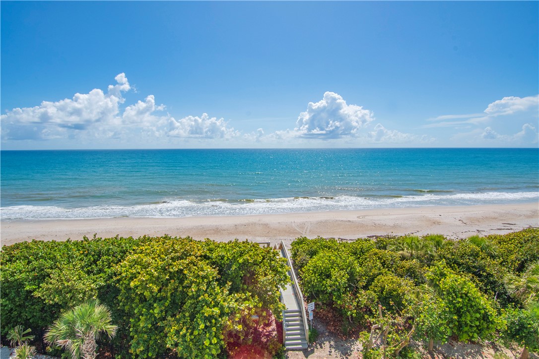 918 Surfsedge Way Indian River Shores, FL 32963 - Photo 26 of 32 a swimming pool with an ocean view