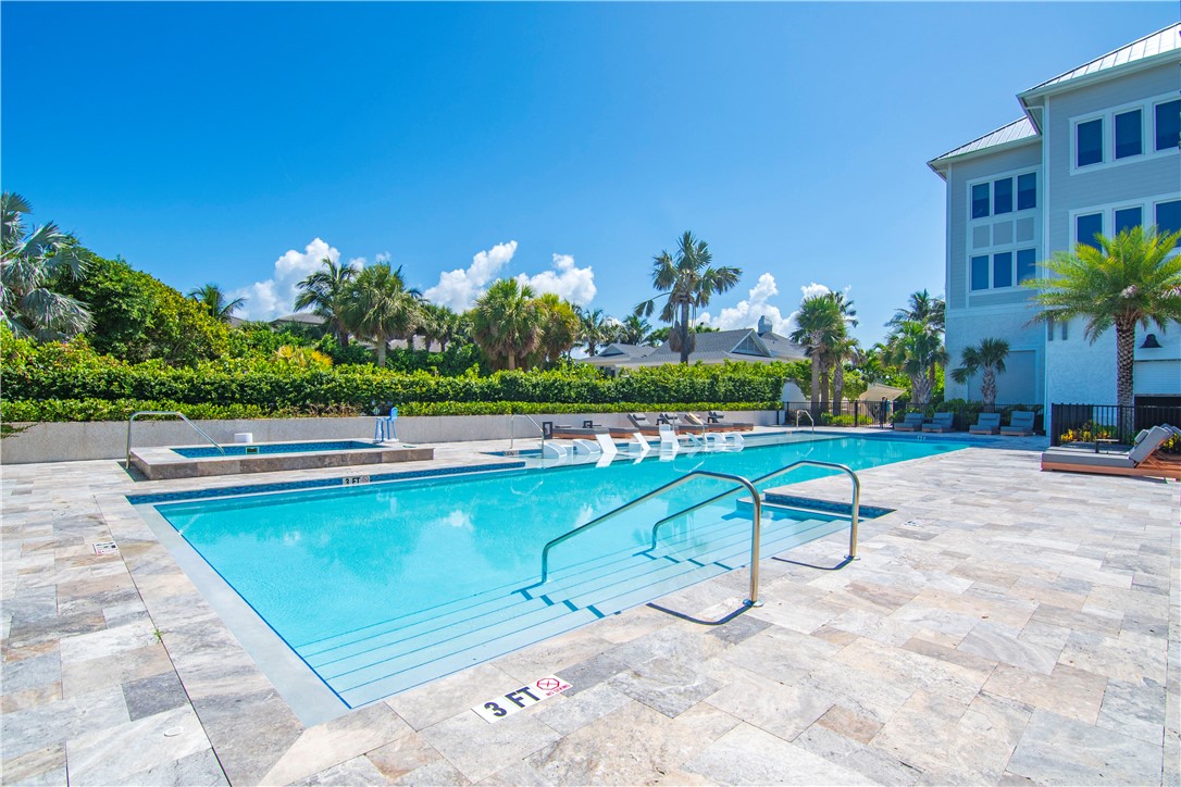 918 Surfsedge Way Indian River Shores, FL 32963 - Photo 30 of 32 a view of swimming pool with outdoor seating and yard in back