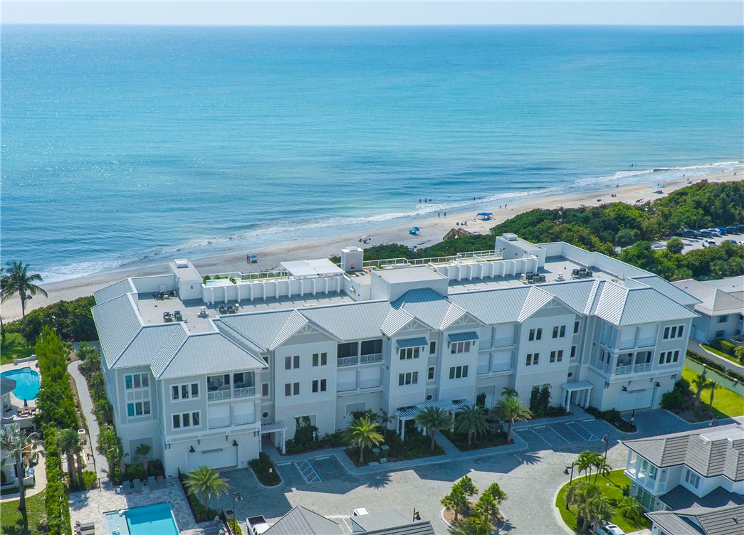 918 Surfsedge Way Indian River Shores, FL 32963 - Photo 32 of 32 a front view of a house with a garden