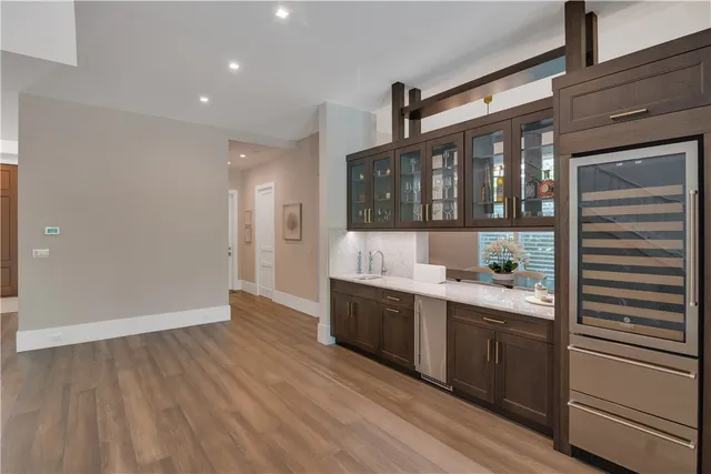 a kitchen with stainless steel appliances granite countertop a sink and cabinets