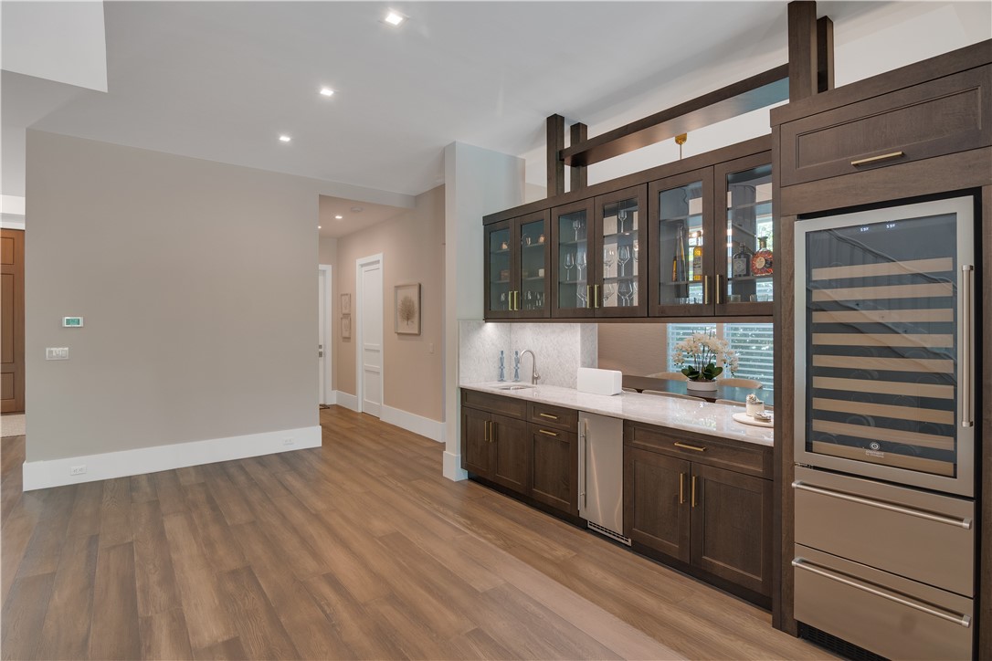 918 Surfsedge Way Indian River Shores, FL 32963 - Photo 7 of 32 a kitchen with stainless steel appliances granite countertop a sink and cabinets