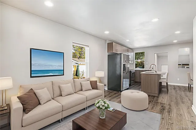 a living room with furniture and a table