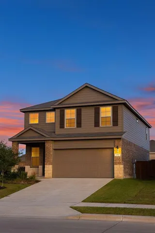 a front view of a house with yard