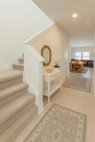 a view of living room with furniture and a rug