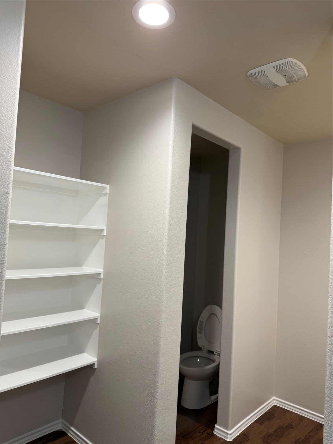 15415 Bosque Viejo Trail Channelview, TX 77530 - Photo 16 of 20 a room with a closet and wooden floor