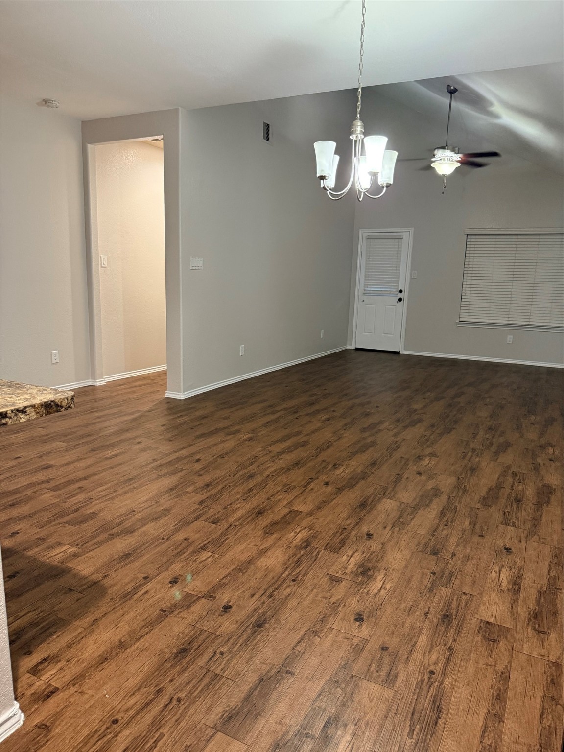 15415 Bosque Viejo Trail Channelview, TX 77530 - Photo 7 of 20 a view of a chandelier fan and wooden floor