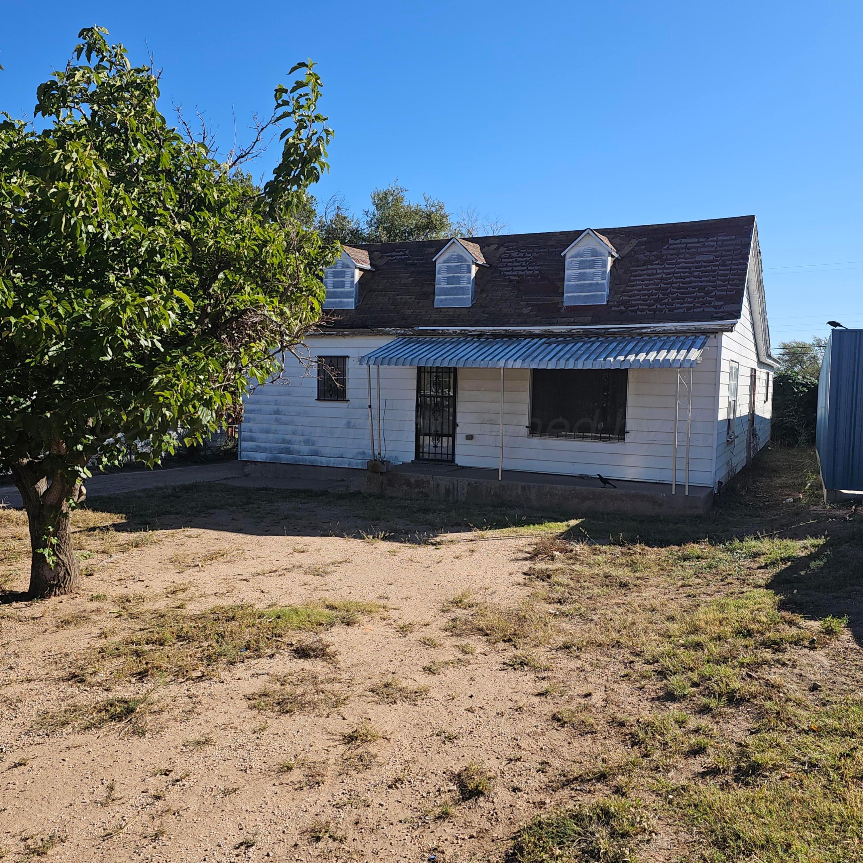 a view of house with snow on the road