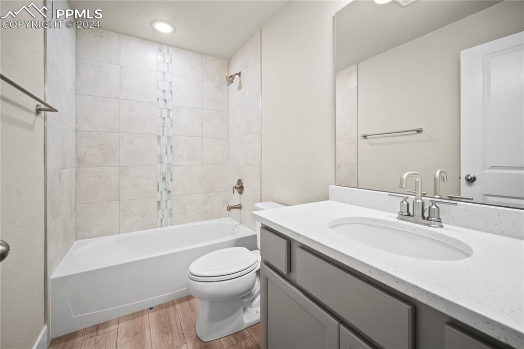 8093 Yellowleaf Place Colorado Springs, CO 80908 - Photo 11 of 23 a bathroom with a sink a toilet and shower