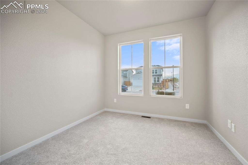 8093 Yellowleaf Place Colorado Springs, CO 80908 - Photo 18 of 23 an empty room with a window