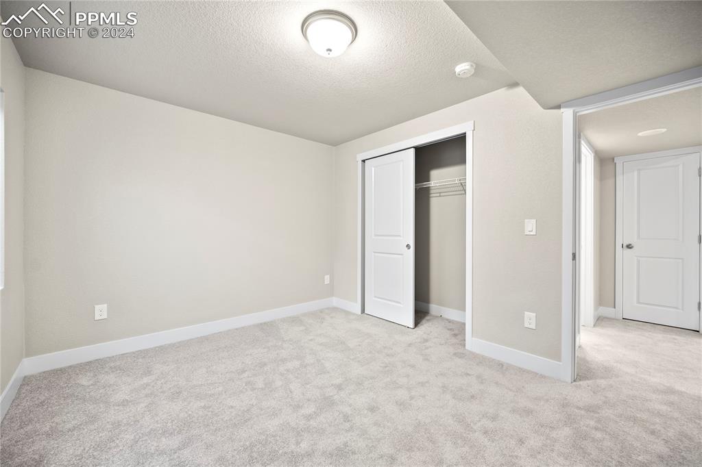 8093 Yellowleaf Place Colorado Springs, CO 80908 - Photo 4 of 23 an empty room with closet area
