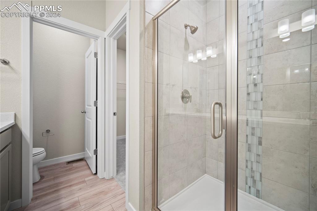 8093 Yellowleaf Place Colorado Springs, CO 80908 - Photo 6 of 23 a bathroom with a shower and a toilet