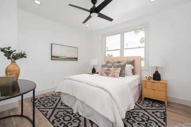 a bedroom with a bed and a window