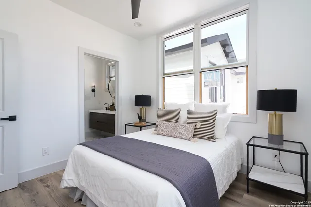 a bedroom with a bed and a window