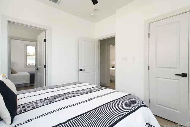 a bedroom with a bed and a dresser