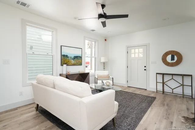 a living room with furniture and a window
