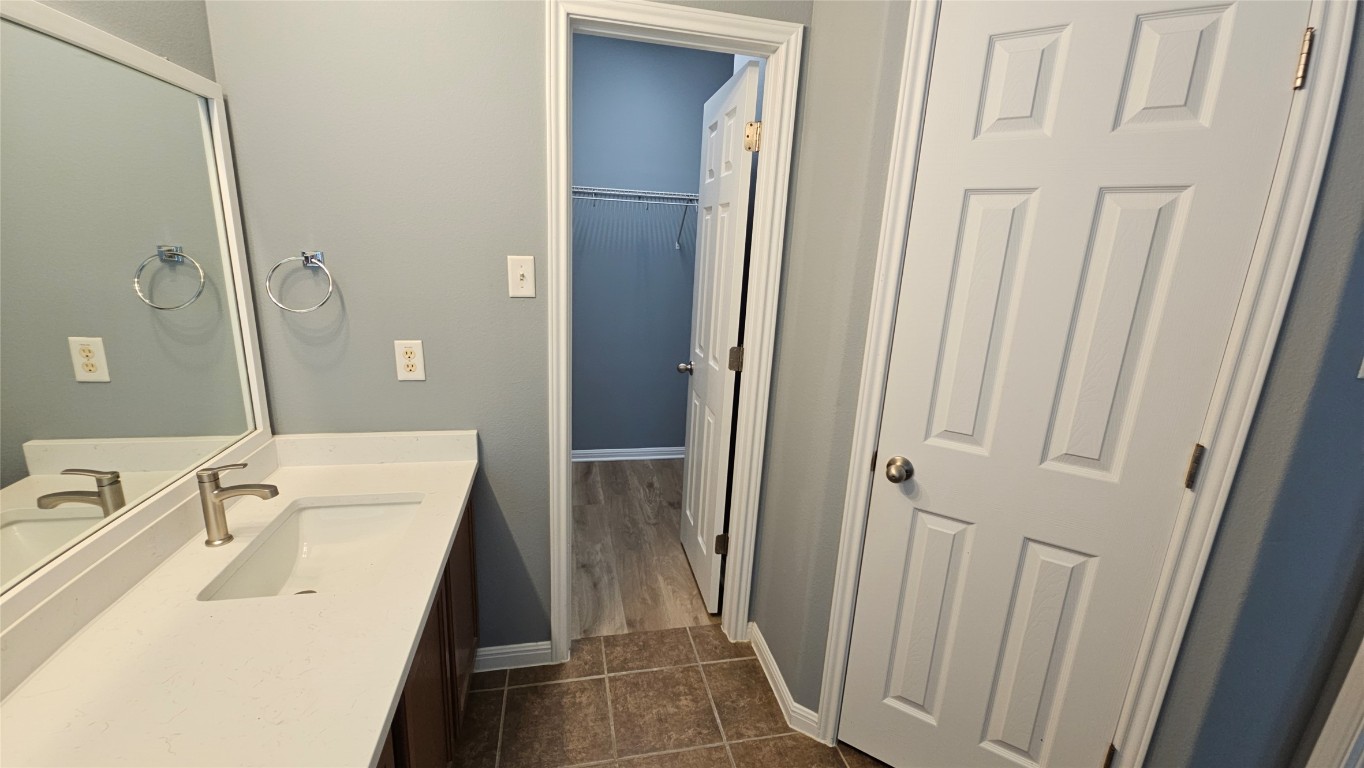 3708 Hawk View Street Round Rock, TX 78665 - Photo 8 of 12 a bathroom with a sink a tub and a mirror