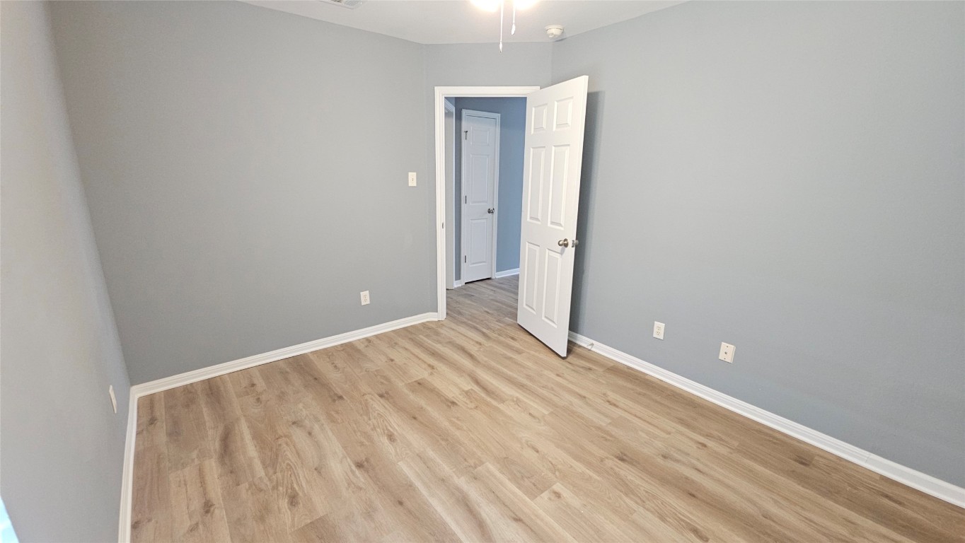 3708 Hawk View Street Round Rock, TX 78665 - Photo 10 of 12 a view of room with wooden floor