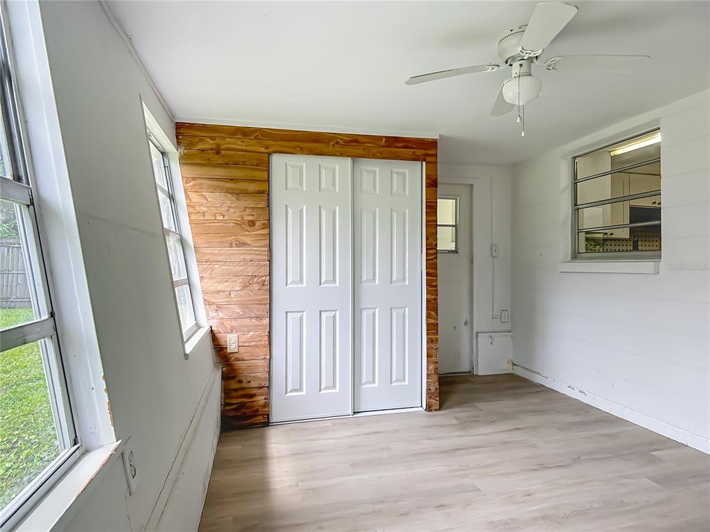 6632 Sierra Terrace New Port Richey, FL 34652 - Photo 17 of 49 wooden floor in an empty room with a window