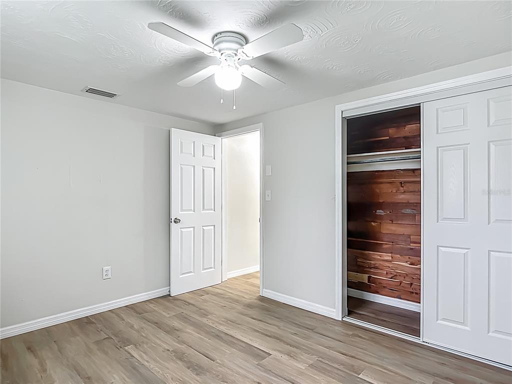 6632 Sierra Terrace New Port Richey, FL 34652 - Photo 23 of 49 a view of an empty room with wooden floor