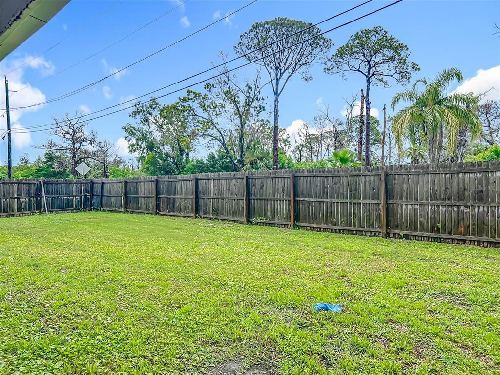 6632 Sierra Terrace New Port Richey, FL 34652 - Photo 32 of 49 a view of a yard with a trampoline