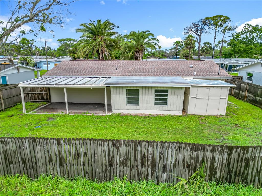 6632 Sierra Terrace New Port Richey, FL 34652 - Photo 36 of 49 a front view of a house with a yard and potted plants
