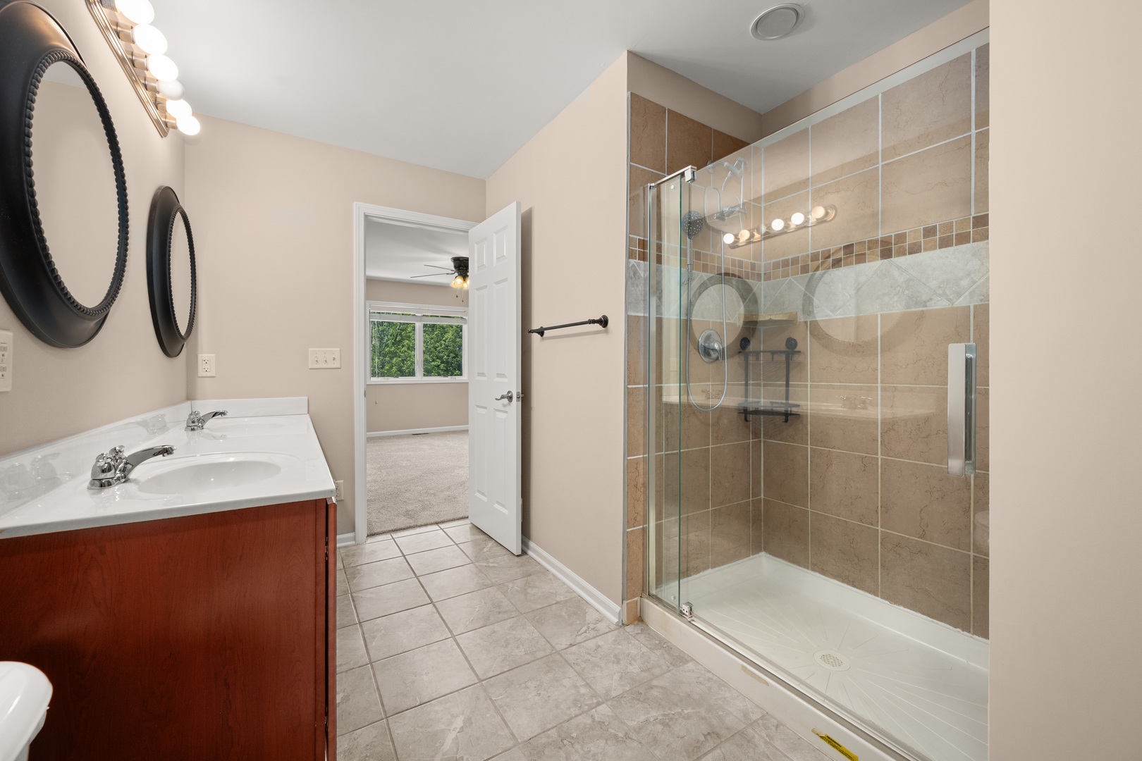 3705 Green Tree Lane DeKalb, IL 60115 - Photo 21 of 31 a bathroom with a shower sink and mirror