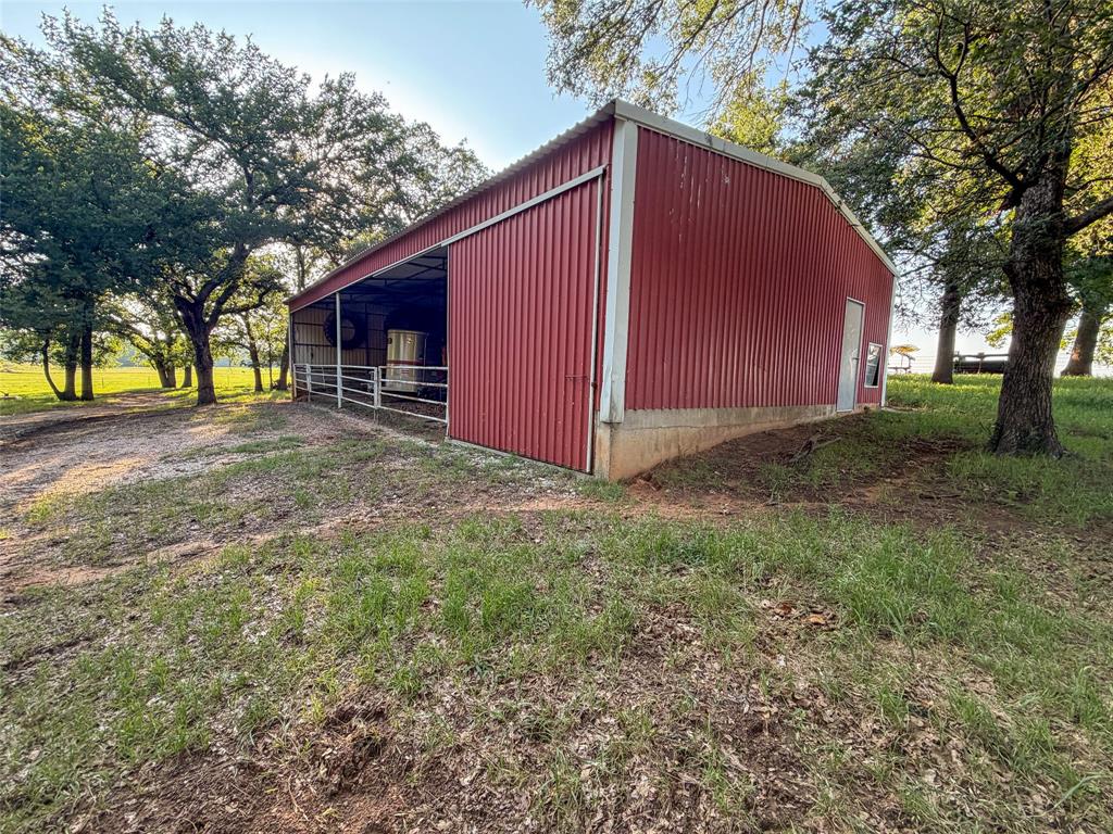 449 Private Road 4670 Rhome, TX 76078 - Photo 38 of 39 a view of backyard with trees