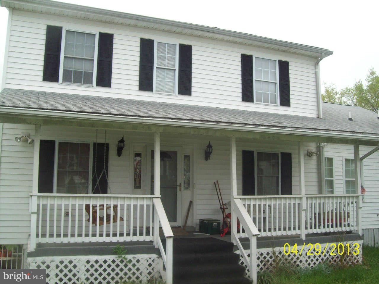 8009 Shore Road Baltimore, MD 21222 - Photo 1 of 19 a view of a brick house with large windows