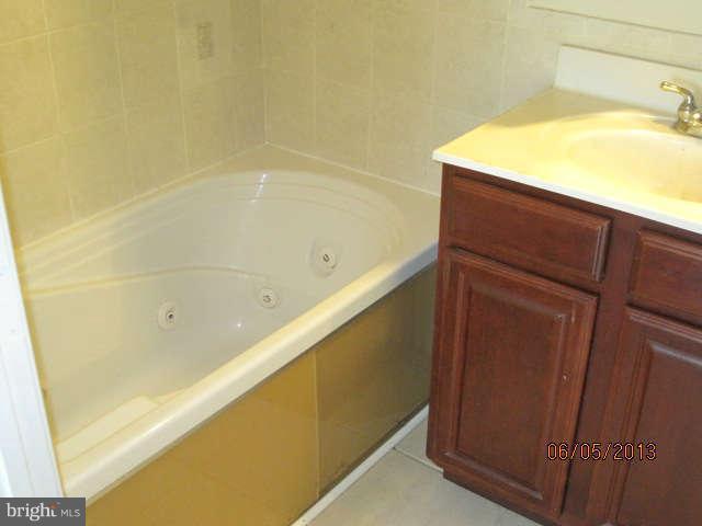 8009 Shore Road Baltimore, MD 21222 - Photo 11 of 19 a bathroom with a bathtub