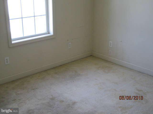 8009 Shore Road Baltimore, MD 21222 - Photo 12 of 19 an empty room with a window