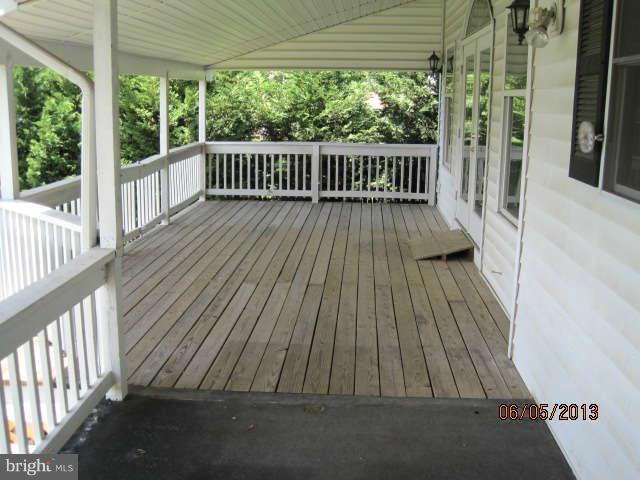 8009 Shore Road Baltimore, MD 21222 - Photo 5 of 19 a view of balcony with wooden floor
