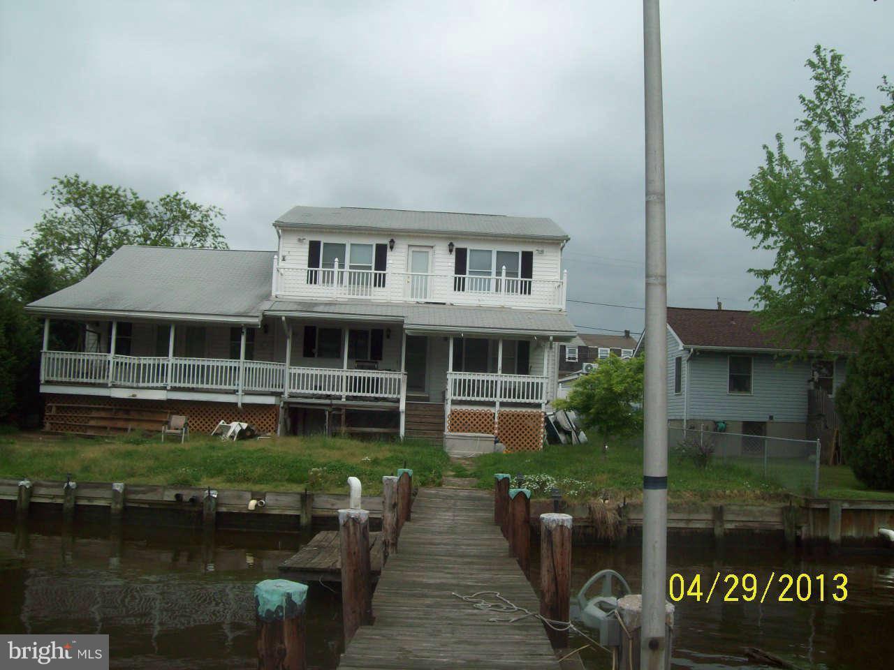 8009 Shore Road Baltimore, MD 21222 - Photo 6 of 19 a front view of a house with garden