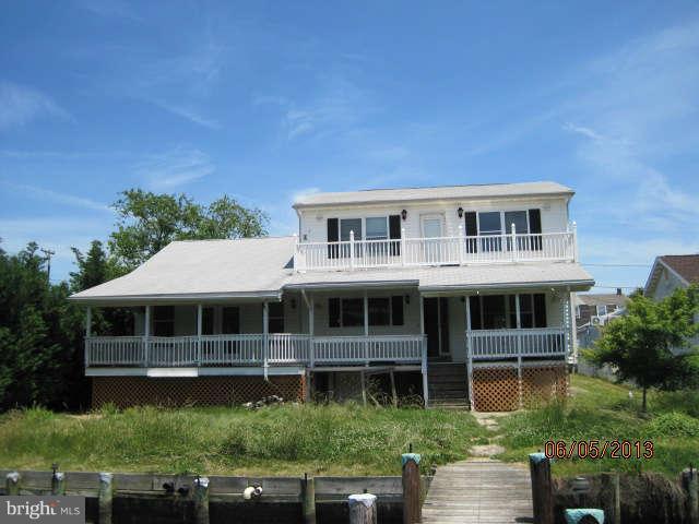 8009 Shore Road Baltimore, MD 21222 - Photo 7 of 19 a front view of a house with a yard